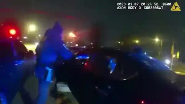 Former Memphis police officers are seen pulling Tyre Nichols out of his car in this video clip. 