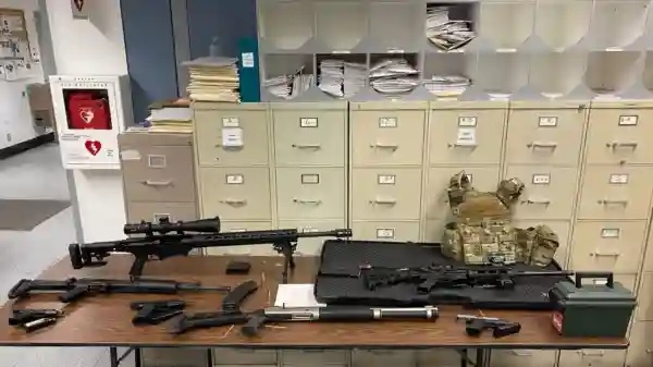 Police shared a picture of the seized illegal firearms found in Johnson's apartment.